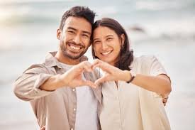 Happy couple making heart at nancy nook