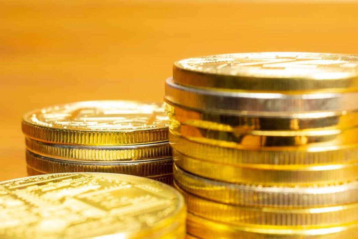 Gold jewelry and gold coins displayed with the current gold rate today in Hyderabad per gram for buyers and investors.